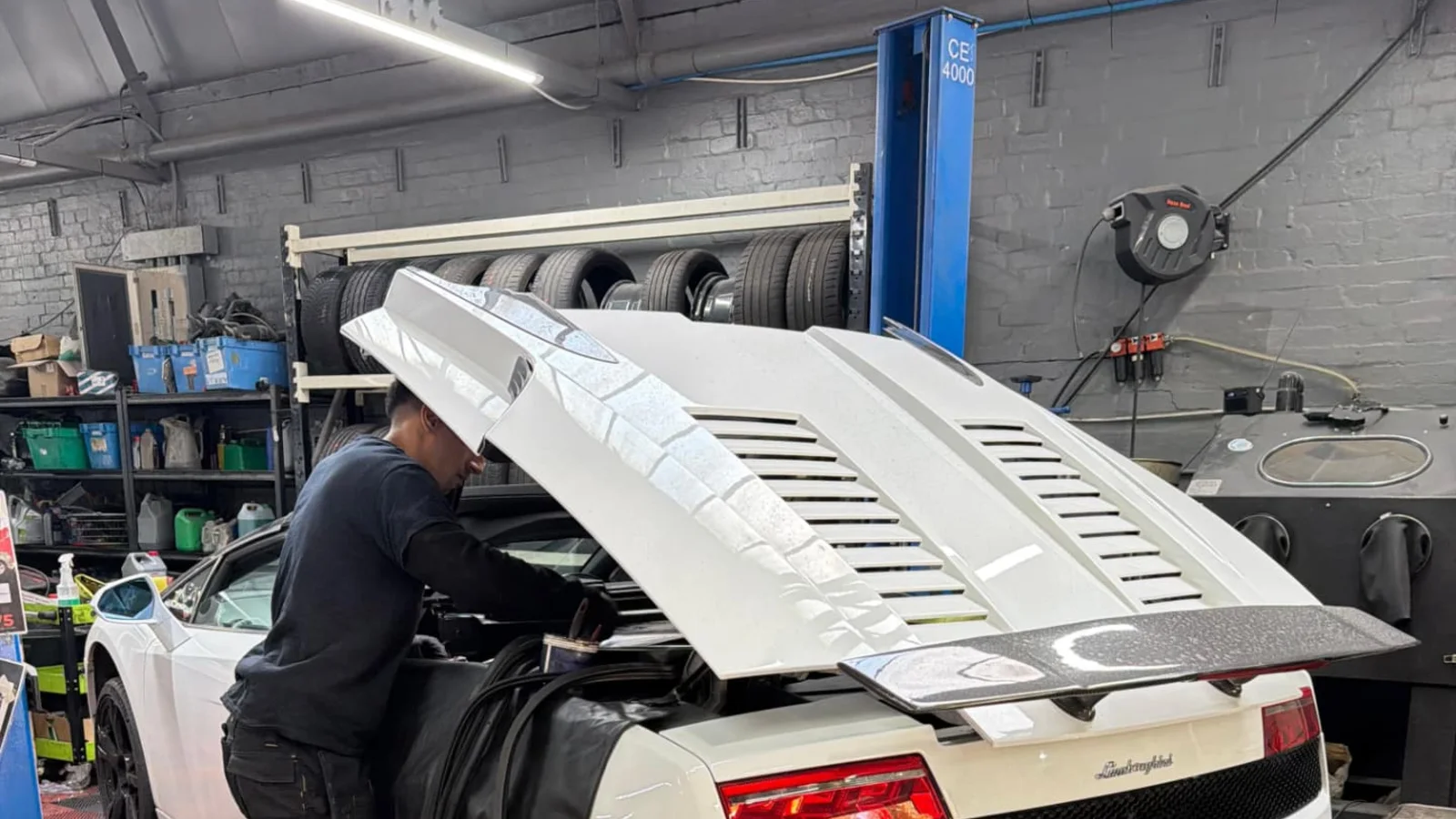 Technician servicing a car in our Slough workshop